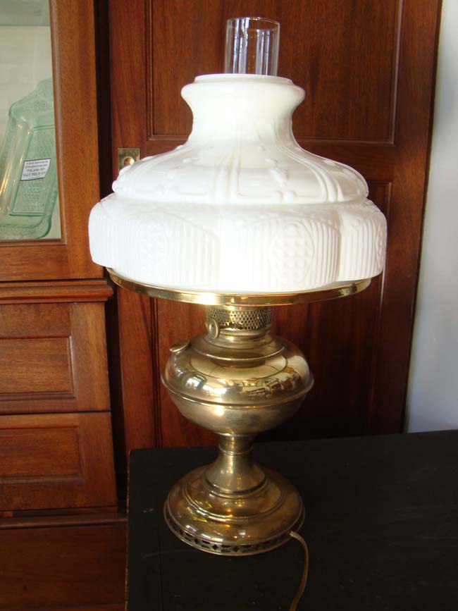 A very attractive 19th century oil lamp with decorative milk glass shade circa 1880